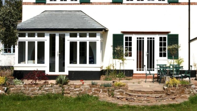White Aluminium French doors and windows in to a rendered house