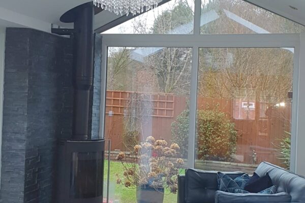 Internal-view-of-gable-fronted-extension-with-log-burner-scaled