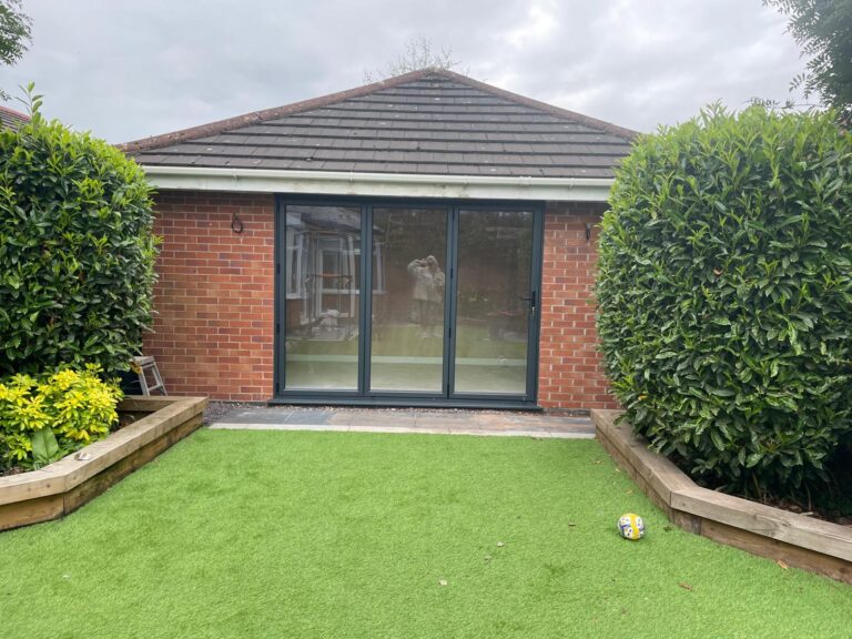 Garage conversion in Newton Le Willows with Grey Bi-folding Doors