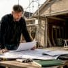 Man reviewing building regulations in garage conversion