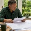 Homeowner reviewing house alteration plans
