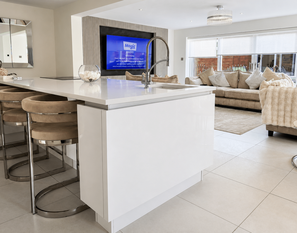 Modern open-plan kitchen and living extension with a large kitchen island completed by Complete Property Solutions.