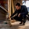 Engineer inspecting extension beam bearing