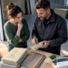 Homeowner reviewing garage office conversion materials