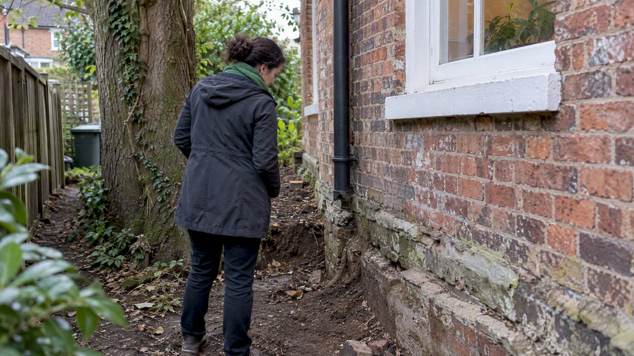 Architect inspecting a period property foundation