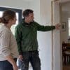 Homeowner and builder inspect a house extension